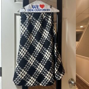 Black and white plaid skirt with a cute pattern and side button detail